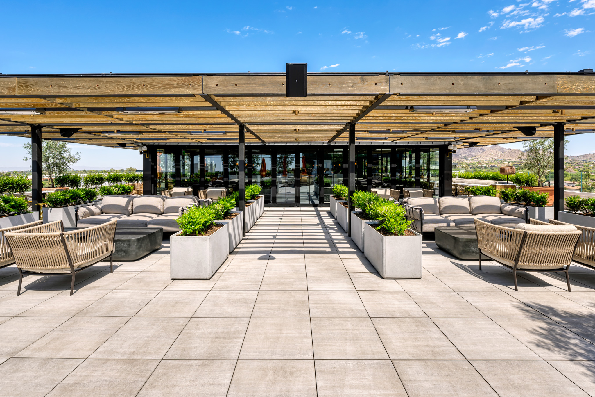 Cream colored travertine porcelain pavers on a roof deck in phoenix. 
