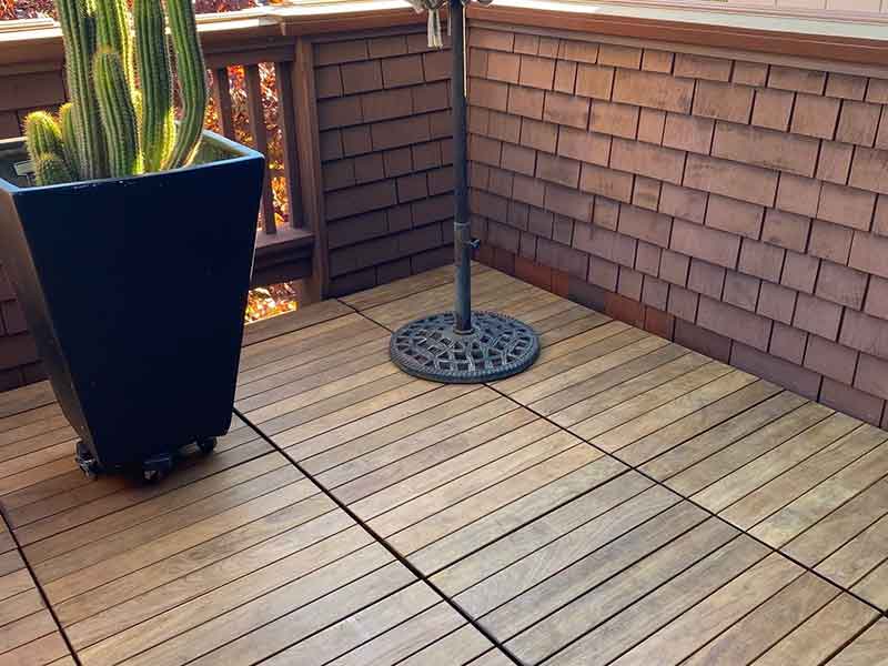 Ipe balcony with lamp and planter.