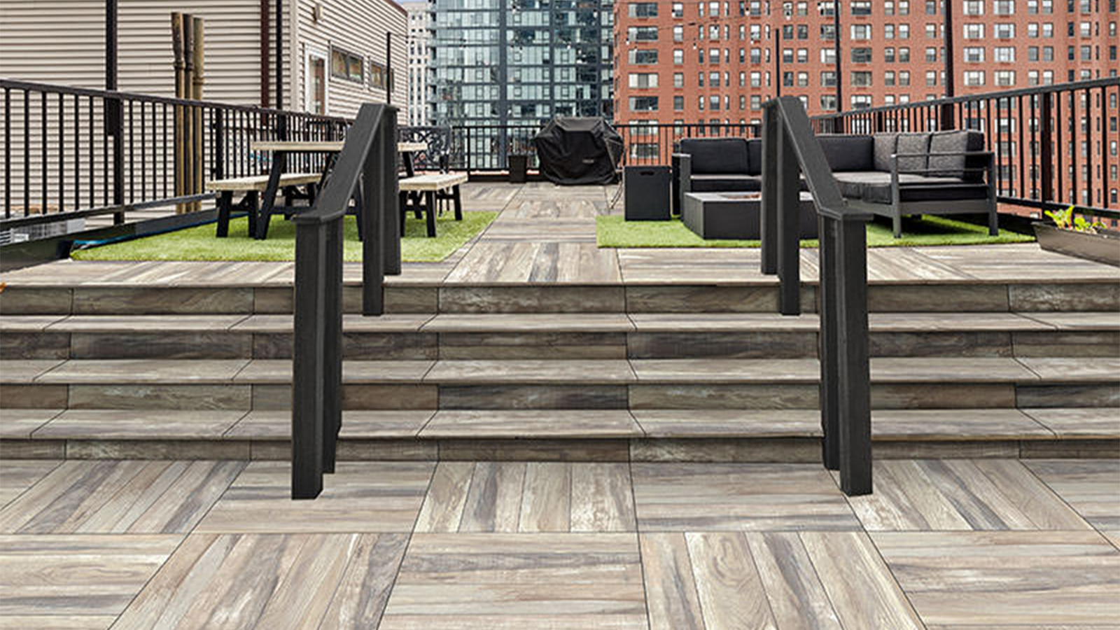 porcelain paver roof deck with porcelain stair treads, couches and table .