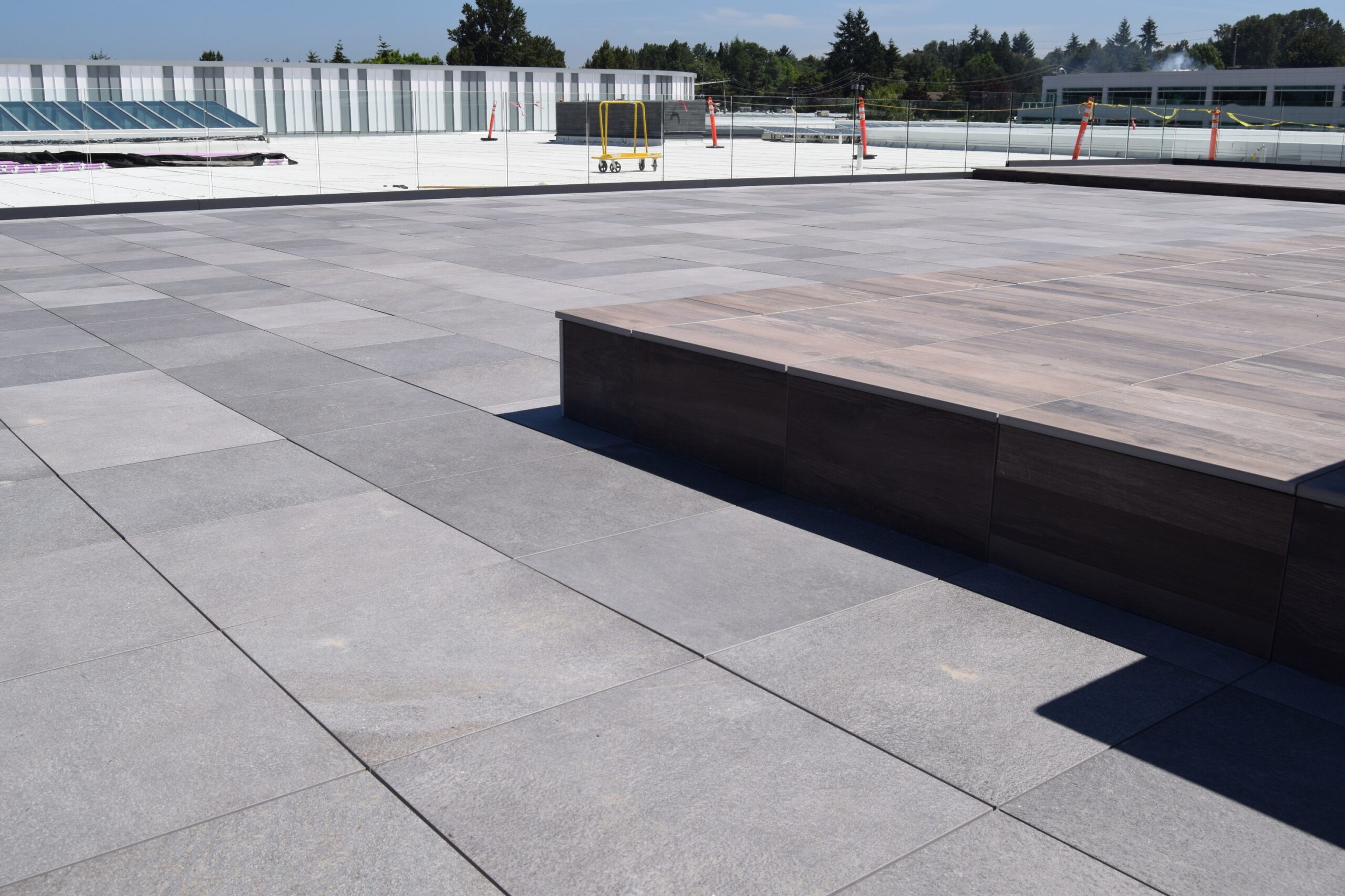 two colors of porcelain pavers on a the google campus roof deck. 