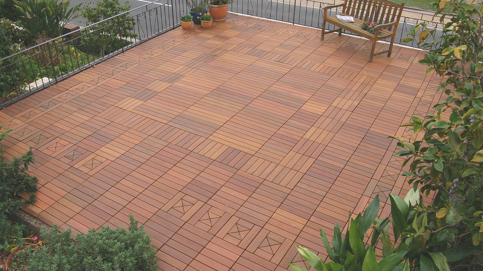 large interlocking ipe tile patio.