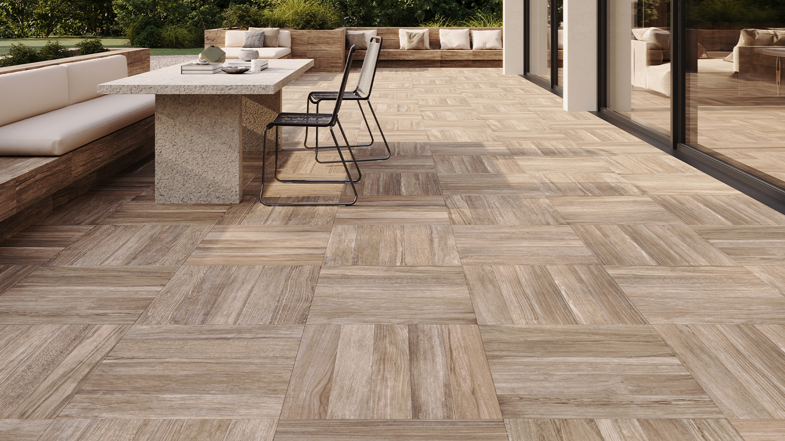 light brown wood look porcelain pavers on residential back patio. 