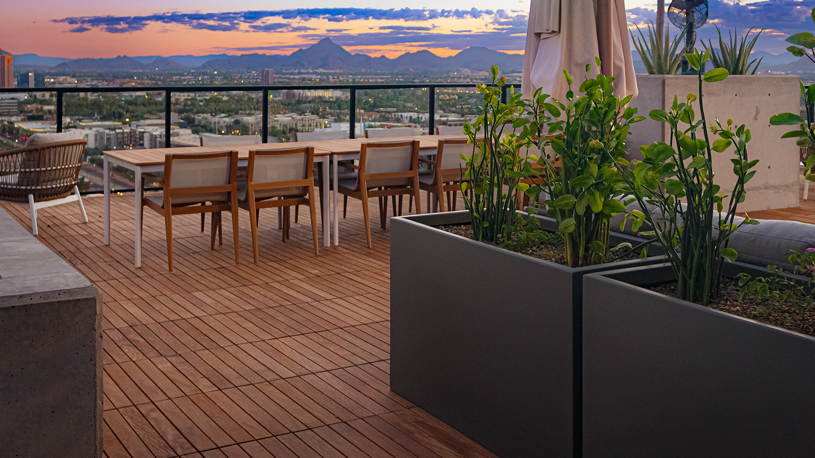 Ipe Structural tile deck with table and chairs at sunset on a roof deck.