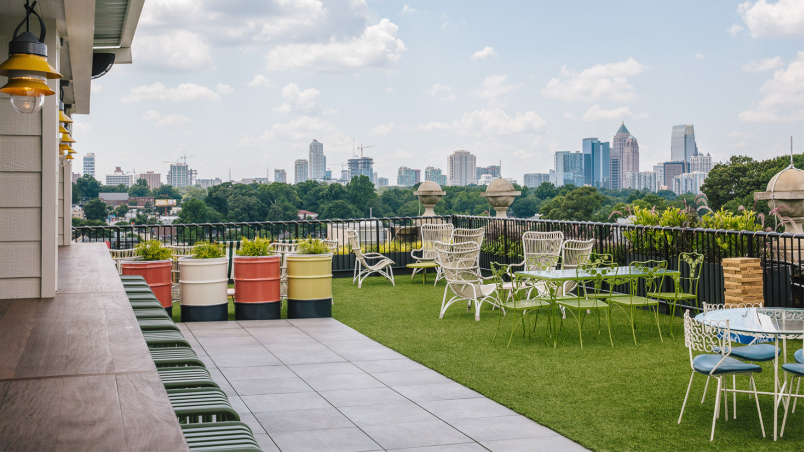 rooftop patio at clermont hotel with bluestone porcelain pavers and artificial turf area.