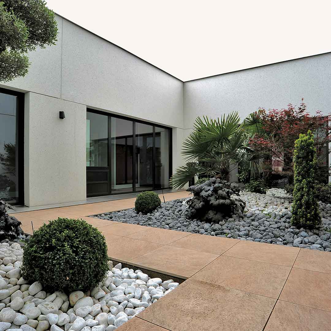 Sienna on grade porcelain pavers through residential courtyard 