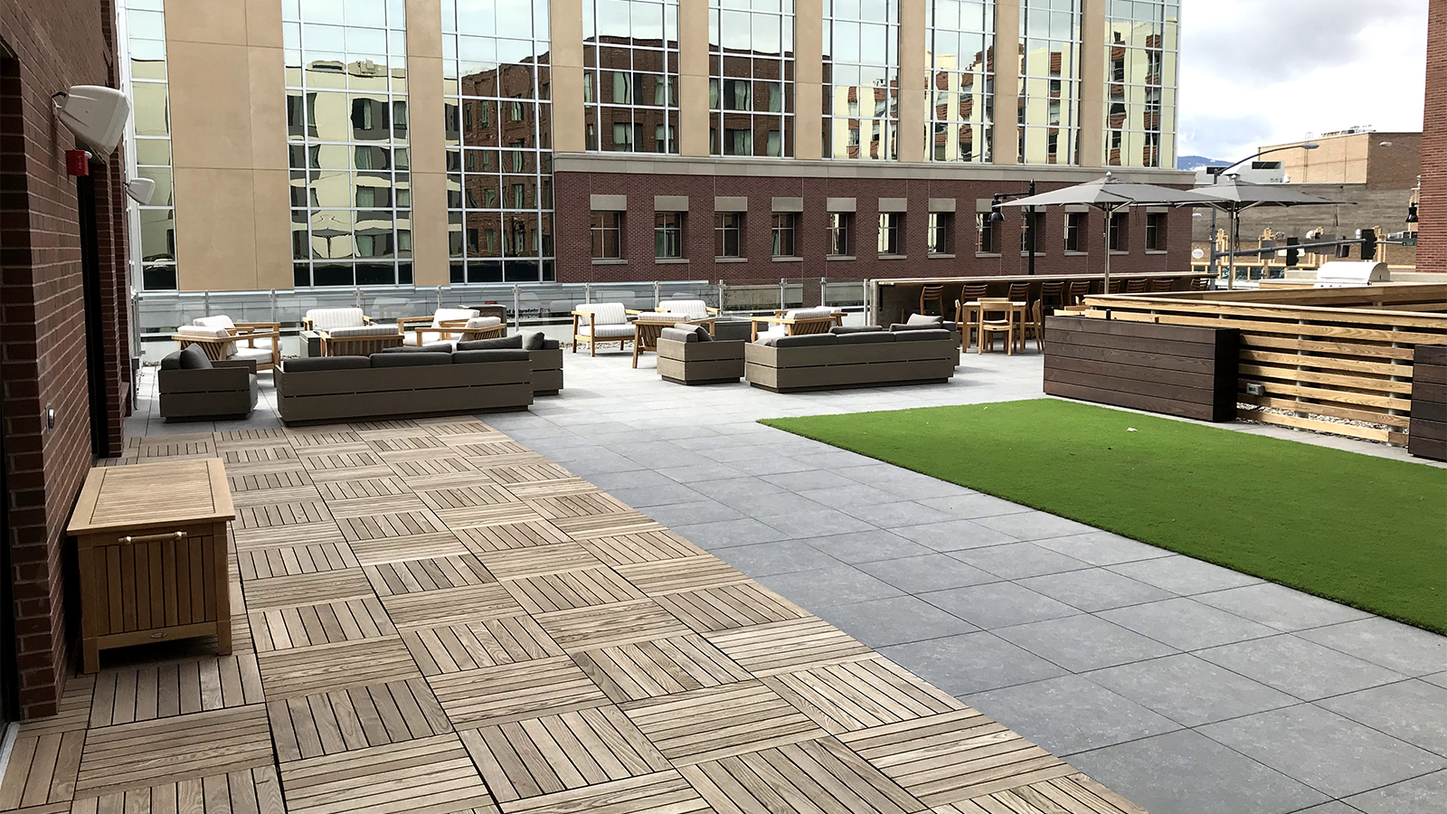 Ipe structural tiles and charcoal porcelain pavers next to each other on a roofdeck in Missoula.