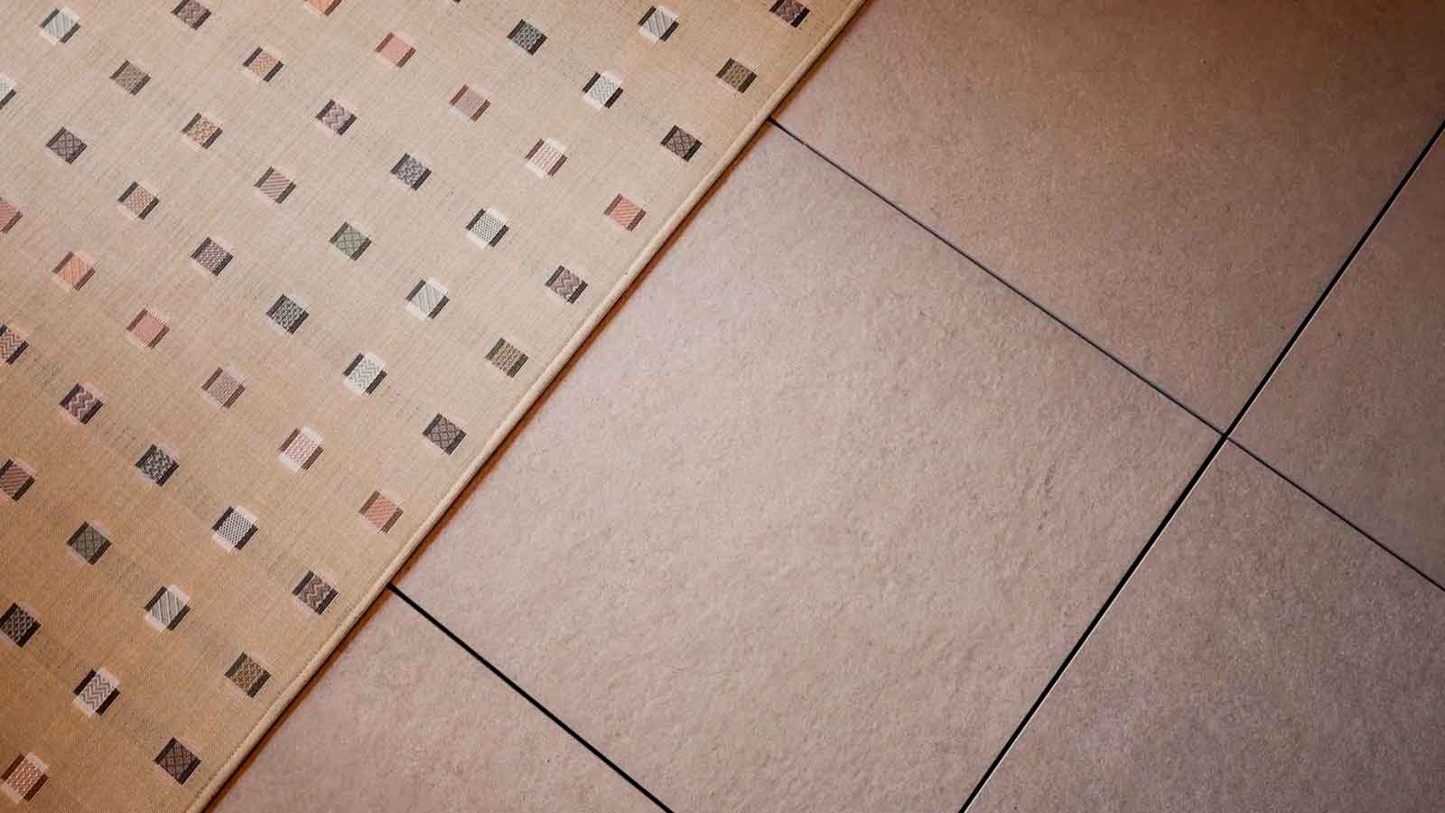 single Riverstone porcelain paver next to a rug. 