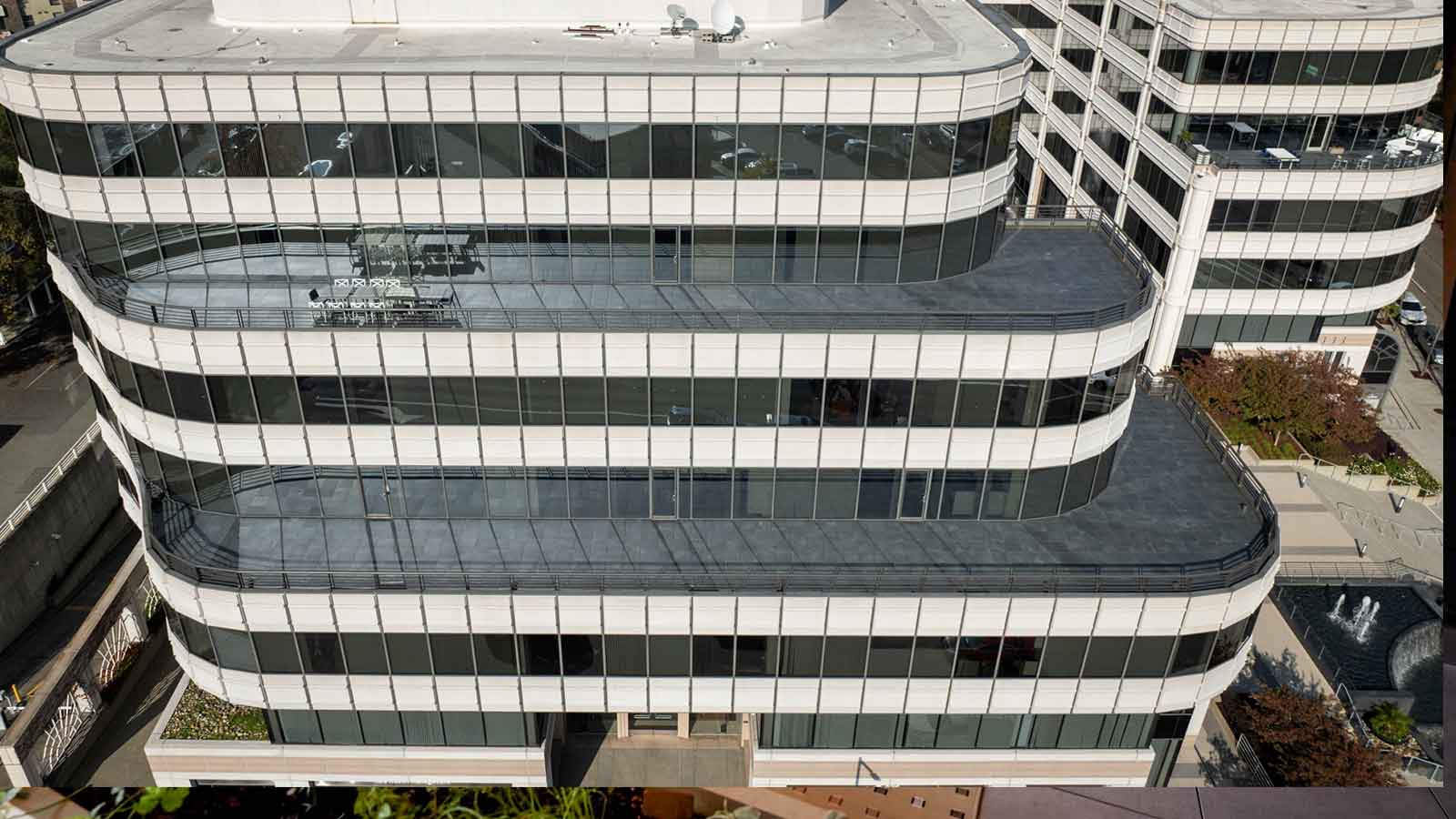 multiple terraces at walnut creek office building with dark porcelain pavers. 