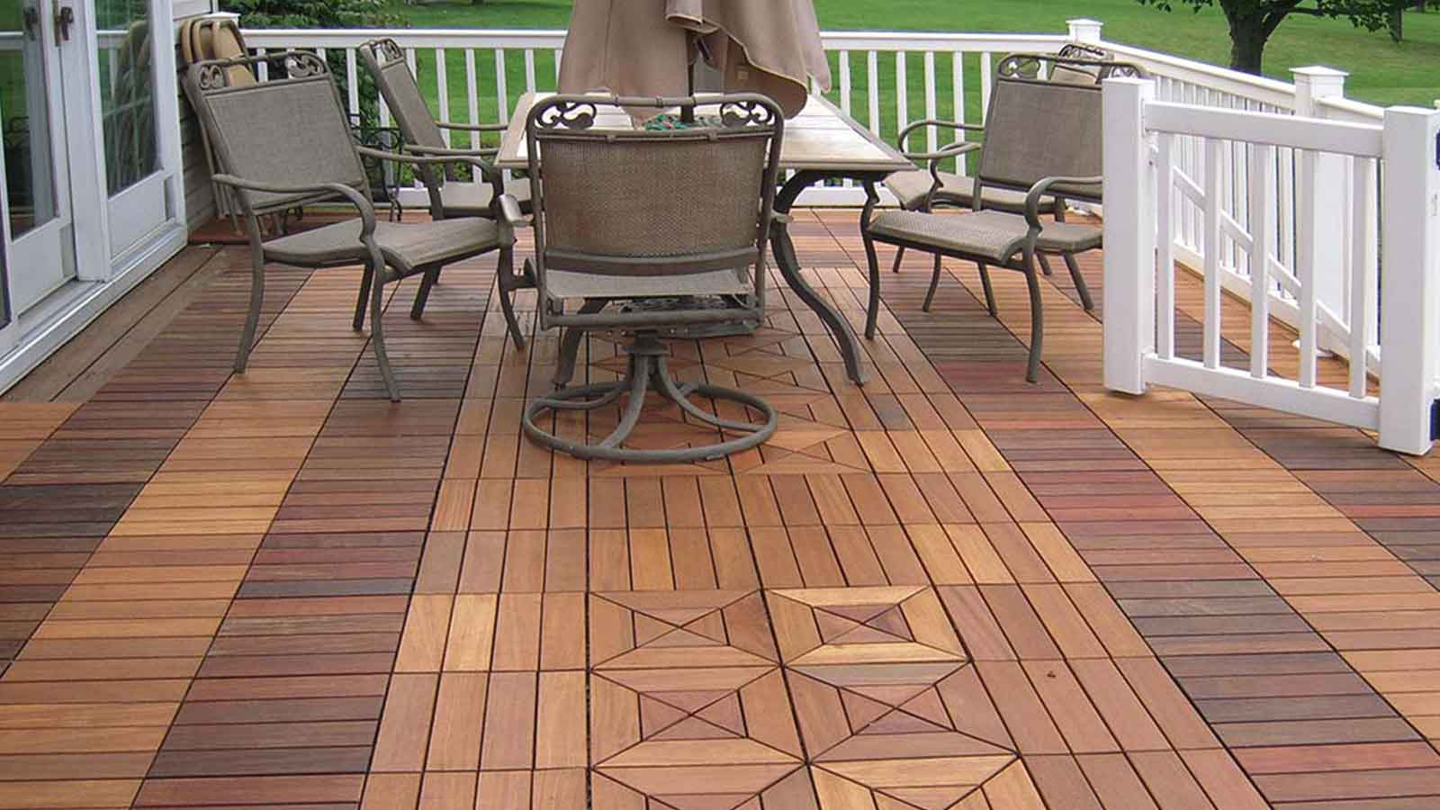 ipe interlocking tile back deck with patio chairs and table