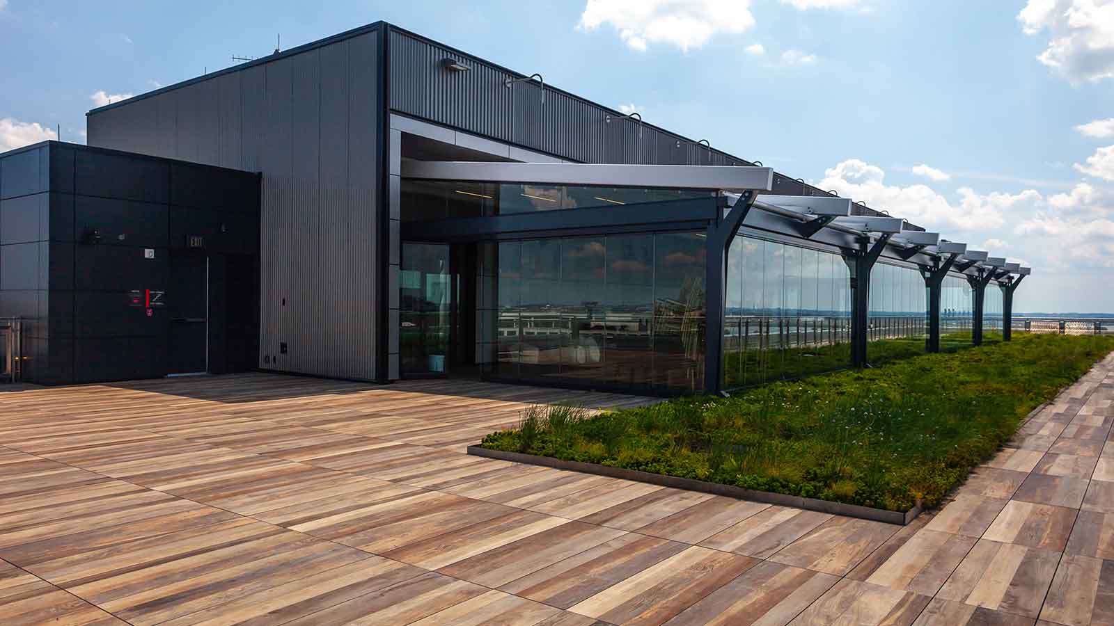 wood look porcelain planks on a roof terrace with a roof garden.