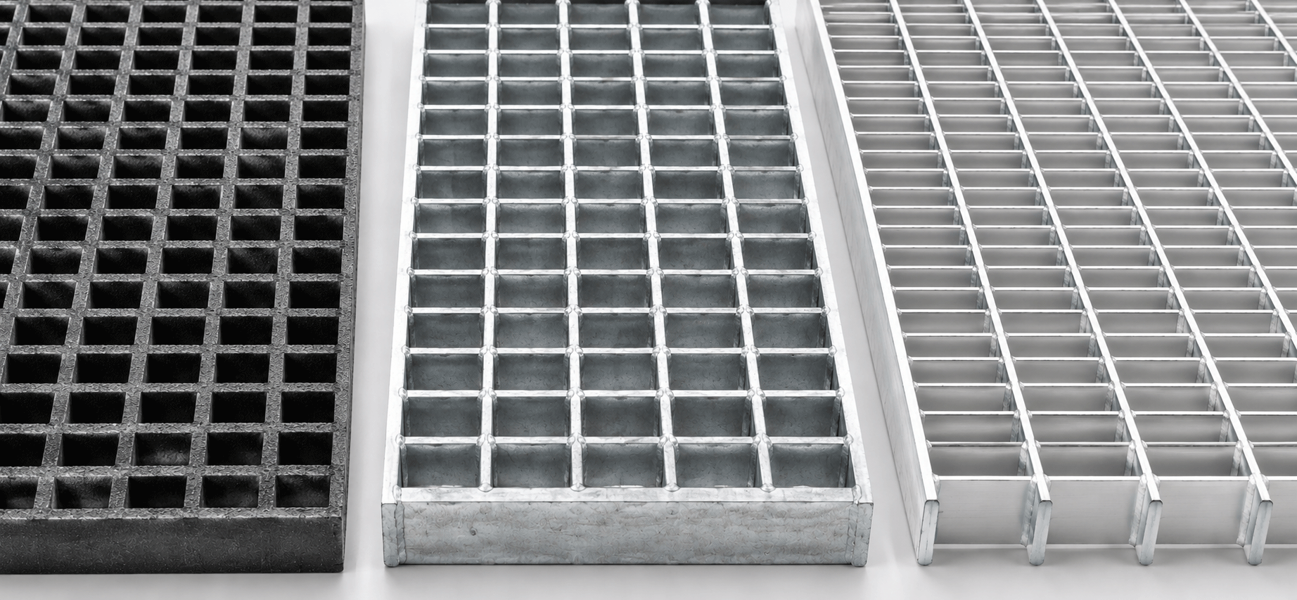 image of FRP grating, steel grating and aluminum grating panels next to one another.